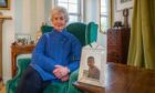 Ann Lindsay, with a photograph of her late son, Duncan, who died in a road accident in France.
