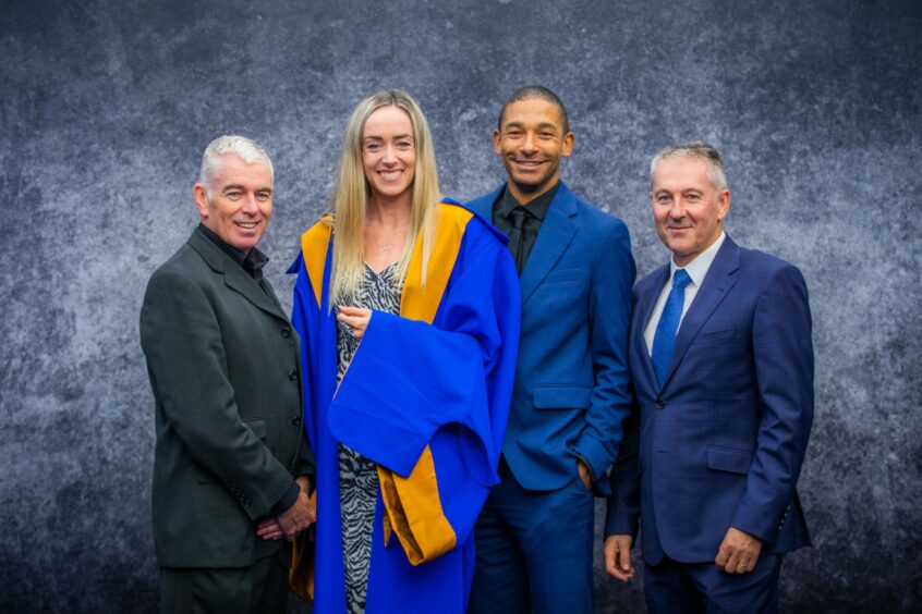 Eilish McColgan receives an honorary degree from Dundee University in November 2022. She's pictured with (from left) dad Peter McColgan, partner Michael Rimmer and uncle Aidan McColgan.