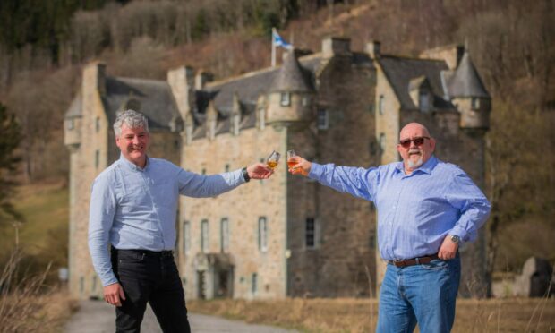 From left: Festival co-organsiers  Ewan McIlwraith and right is Sandy Fraser outside the former festival venue Castle Menzies, Weem, Aberfeldy. Image: Steve MacDougall/DC Thomson