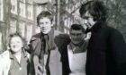 Sandy Laing, right, and his friend Alec Stobie, with locals in Amsterdam in 1969.
