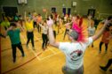 Fair Isle Primary held a fundraising dance-a-thon for Children in Need. Youngsters were dancing continuously for the fundraiser led by DJ Mikey Mowhawk. Image:  Steve Brown / DC Thomson