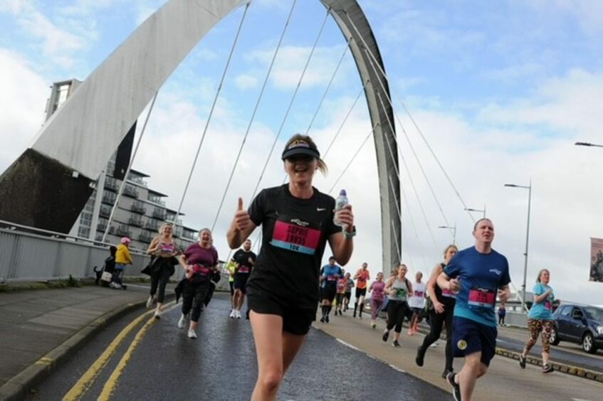 Sophie running over Glasgow's Squinty Bridge
