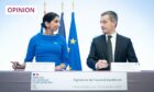 photo shows Suella Braverman and the French Interior Minister Gerald Darmanin signing an agreement aimed at tackling the small boats crisis in the Channel.