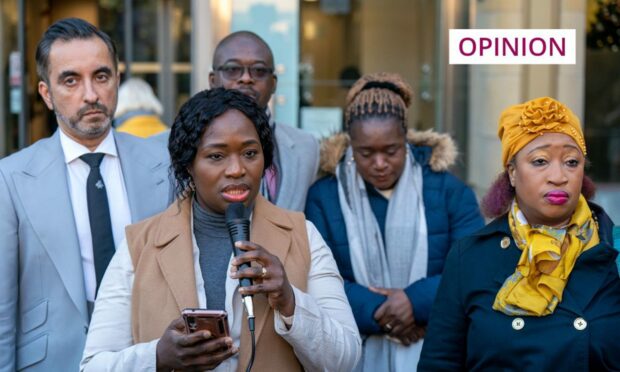 photo shows Sheku Bayoh's sisters and lawyer Aamer Anwar speaking to a crowd outside Capital House in Edinburgh.