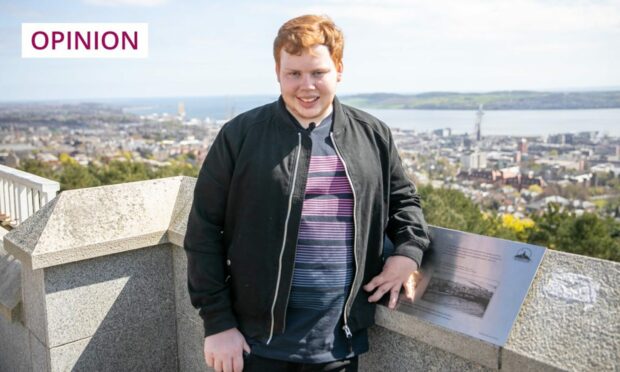 photo shows Andrew Batchelor at the Law monument, Dundee, with the city spread out behind him.