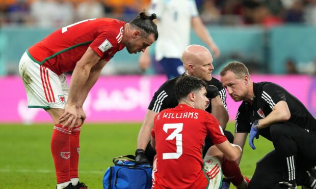 Neco Williams receives treatment. Image: PA.