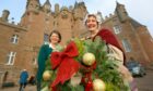 Charlotte Inglis and Gail Renwick with a Christmas Wreath at Glamis Castle in a previous year. Image: DC Thomson.
