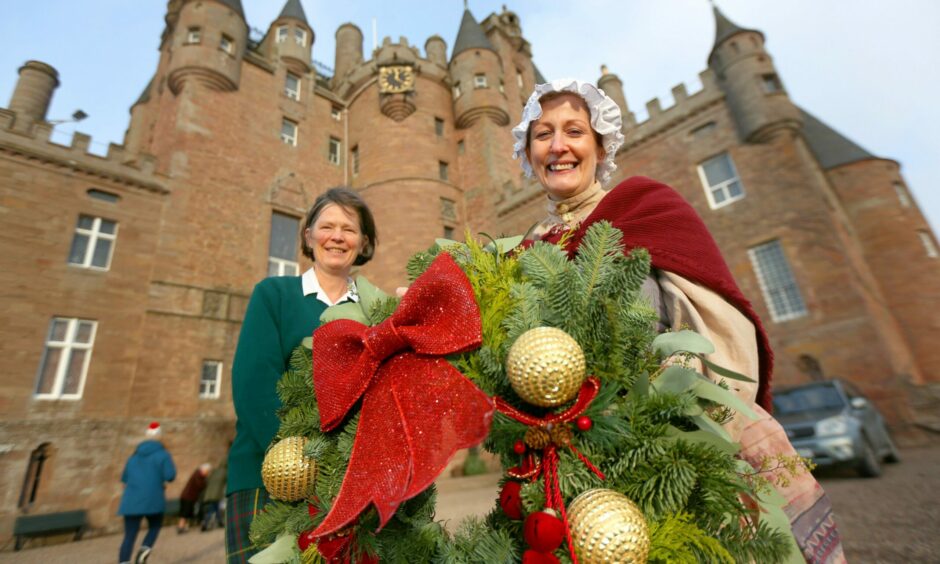 Charlotte Inglis and Gail Renwick with a Christmas Wreath at Glamis Castle Christmas market