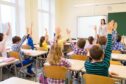 A classroom of pupils ready to learn.