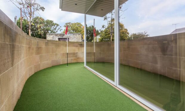 This St Andrews flat, which is up for sale, comes complete with its own putting green. Image: Thorntons.