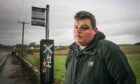 Chris Cameron, youth worker, is disappointed with the lack of bus options for people in Newport and the access to the bus stops themselves. Image: Mhairi Edwards/DC Thomson