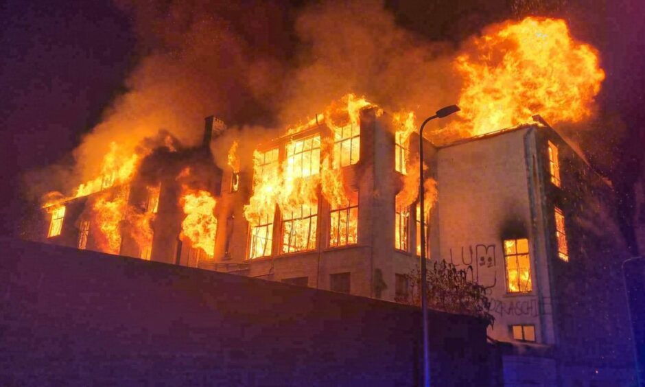 Robertson's furniture store at the height of the fire on Barrack Street. 