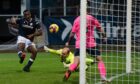 Zach Robinson scores for Dundee following a corner.