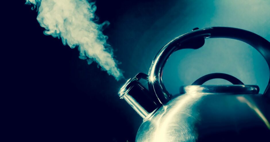 Photo shows steam rising from an old-fashioned kettle.