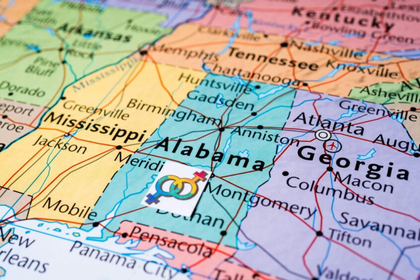 image shows a map of the US, with an LGBTQ symbol pinned over Alabama.