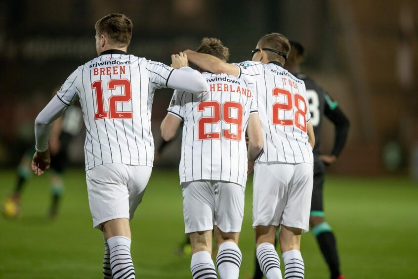 Taylor Sutherland is congratulated by his Dunfermline teammates after scoring against Celtic B.