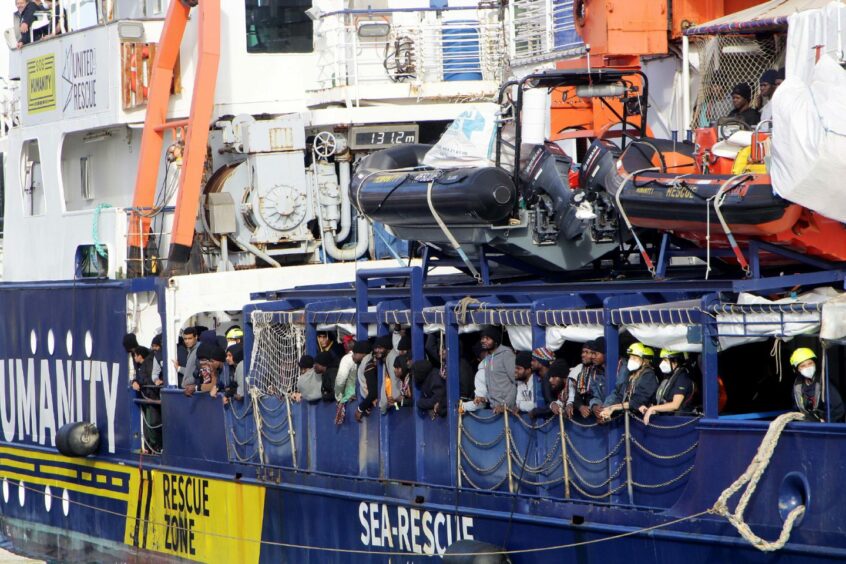 A ship with 261 migrants on board arrives at Bari, Italy