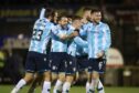Dundee players Cillian Sheridan, Paul McMullan, Luke McCowan and Jordan McGhee celebrate victory at Ayr. Image: David Young/Shutterstock.