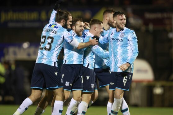 Dundee players Cillian Sheridan, Paul McMullan, Luke McCowan and Jordan McGhee celebrate victory at Ayr. Image: David Young/Shutterstock.