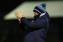 Dundee manager Gary Bowyer salutes the travelling Dundee support at Ayr. Image: SNS.