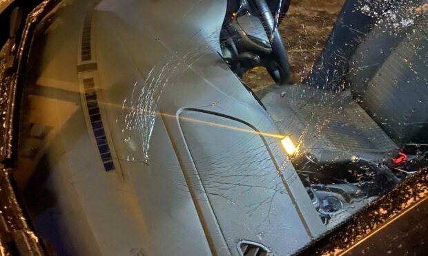 Cars have been smashed and shops damaged in Cardenden on Thursday night. Image: Cole Gilfillan.