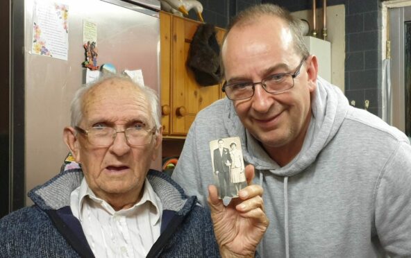 Glenrothes pensioner Allan Monro and son Allan junior with the 'lost' wedding photo. Image: Allan Monro.