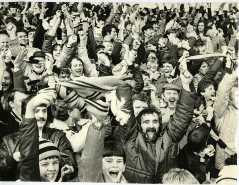 Dundee United fans packed into Dens Park to watch their side win the title. Image: DC Thomson