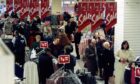 Shoppers in Littlewoods on Boxing Day in 1995 attempting to grab a bargain. Image: DC Thomson.