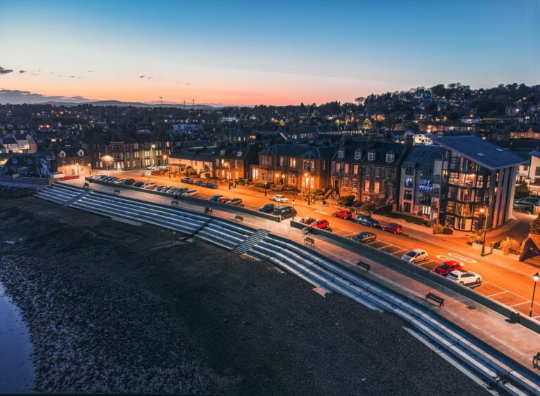 aerial view of Broughty Ferry beach and houses at sunset.