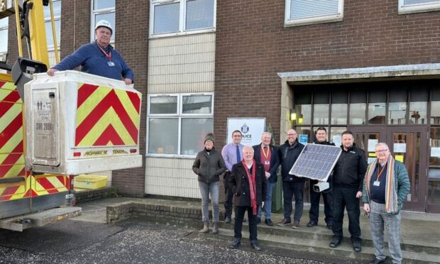 Fife police, community safety officers and councillors take possession of the solar CCTV at Levenmouth police station. Image: Councillor Ken Caldwell.