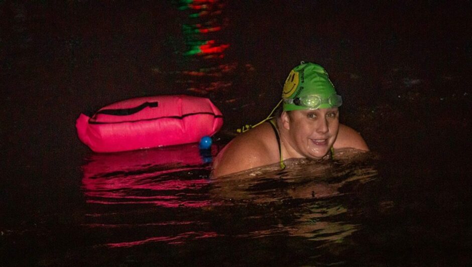 Colleen swimming in the dark in Los Angeles. 