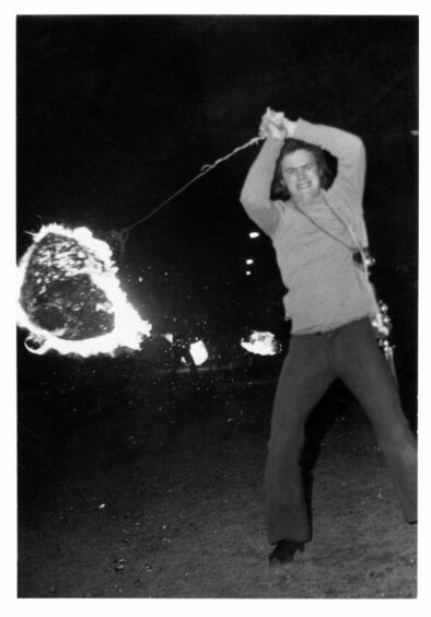 man swinging a fireball in Stonehaven's traditional ceremony in the 1970s.