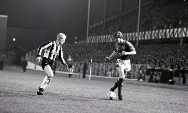 GN 1987-12-15_02 Rangers FC vs Dunfermline AFC ©DCT

Pars counter-punch way to a draw
Rangers 2- Dunfermline 2
Dunfermline gained a precious point at Ibrox last night and the credit must go to the defence.  
Attendance: 31, 687
Referee: GA Evans, Bishopbriggs
C&A 16/12/87

[Rangers Football Club versus Dunfermline Athletic Football Club in action at Ibrox during a Scottish Premier Division game.]