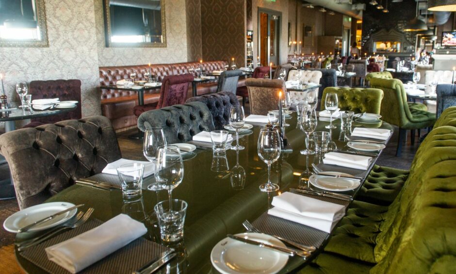 A fully set table in the dining room at The Malmaison in Dundee, which offers a new year's eve set dinner menu