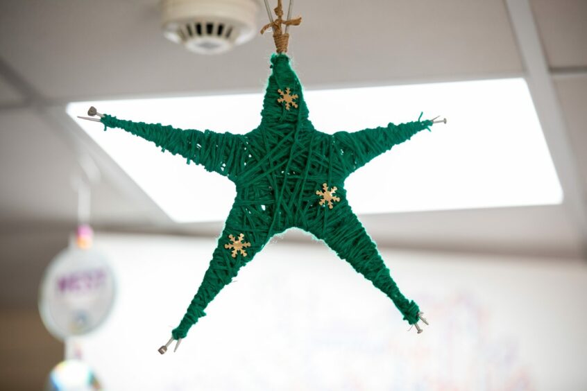 A star made from old knitting needles.