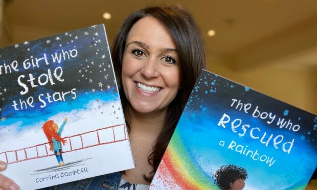 Author and illustrator Corrina Campbell with her two children's books, The Girl Who Stole The Stars and The Boy Who Rescued a Rainbow. Image: MuckleMedia.