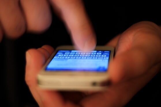 A closeup of a mobile phone in use