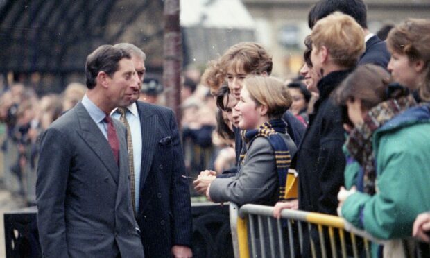 The future king made time for everyone, including Dundee High School pupil Charlotte Blair, during his walkabout in 1992. Image: DC Thomson.