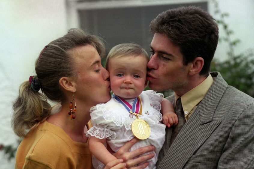 Scotland's Liz McColgan with her baby daughter Eilish and husband Peter back at her home in Abroath, after winning the gold medal in the 10,000 metres in Tokyo at the World Championships in 1991.