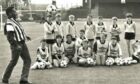 Pele shows off his skills at Dens Park in front of local schoolkids.