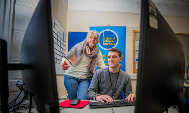 New Perth CAB employees Dawna Ashby and Steven Laurie were hired to cope with the number of people who need help with energy bills. Image:  Steve MacDougall / DC Thomson