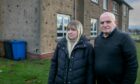 Yasmine Ednie with dad John outside the affected flats. Image: Steve Brown / DC Thomson.