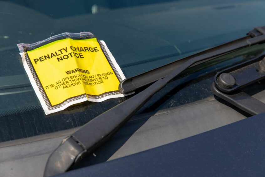 A parking ticket on a windscreen