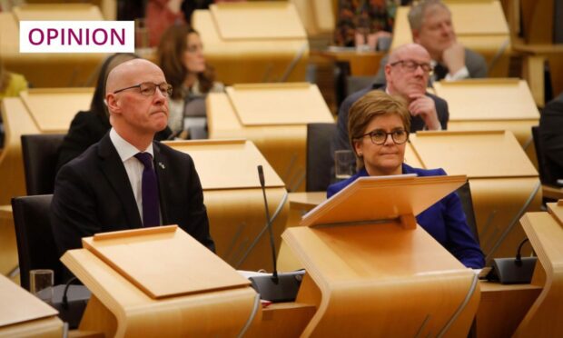 John Swinney and Nicola Sturgeon in the Scottish Parliament.