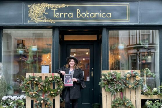Hannah Ballantyne standing outside Terra Botanica Perth with the 2022 gift guide.