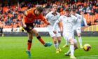Dundee United kid Rory McLeod fires an effort at goal during Saturday's clash with Swansea. Image: SNS