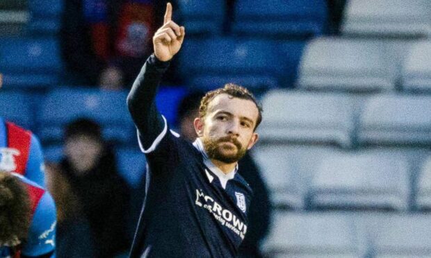 Paul McMullan celebrates after scoring a goal during his time with Dundee.