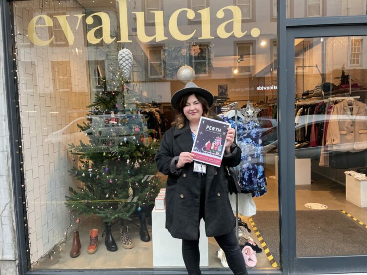 Hannah Ballantyne standing outside Evalucia with a Perth Gift Guide.