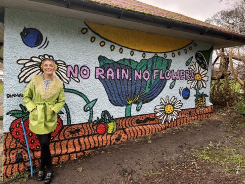 Artist Diane Selbie with her mural Diamages. Image: Pamie Bennet.