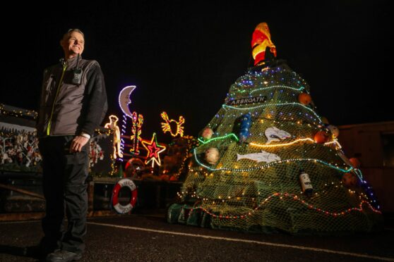 Arbroath harbour assistant Grant Milne with his creation. Image: Mhairi Edwards/DC Thomson
